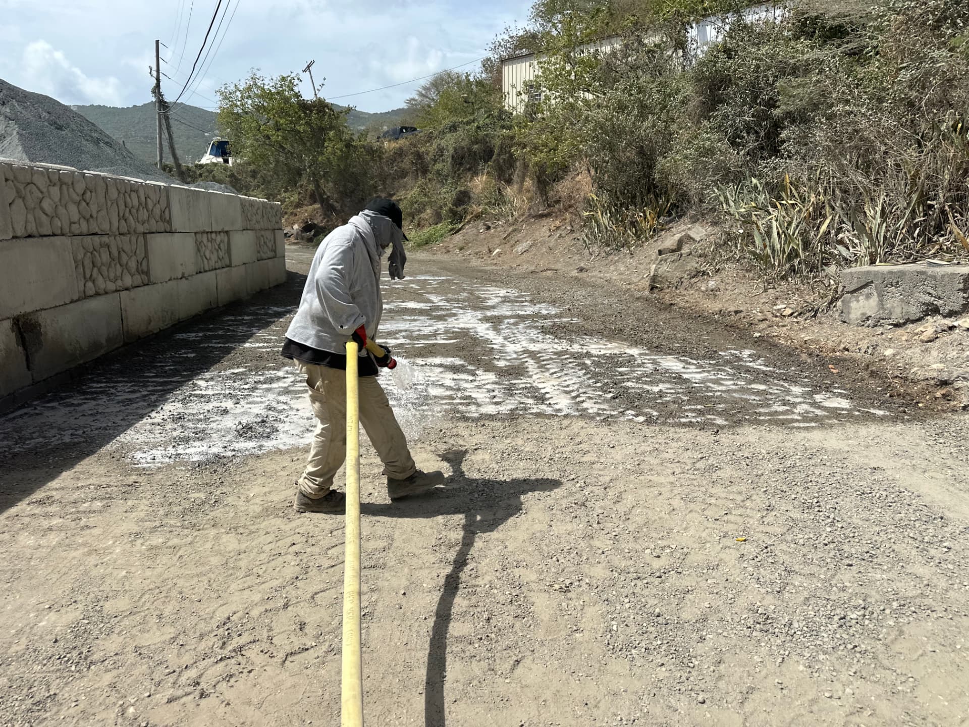 Solid Earth being applied to a working access road at a concrete plant